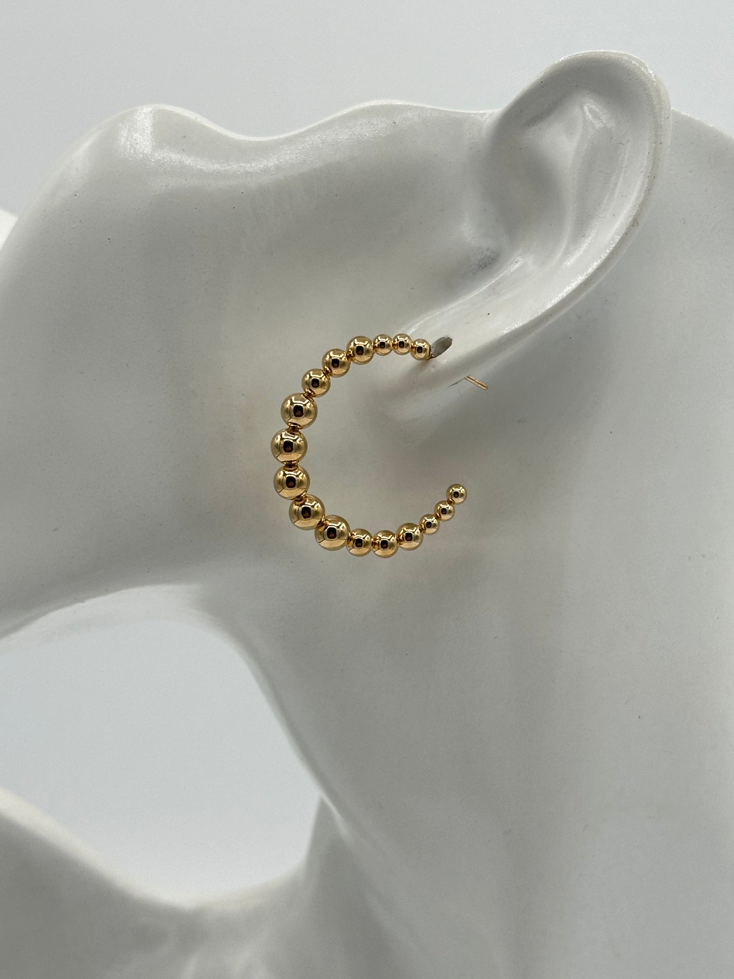 Aretes Caris